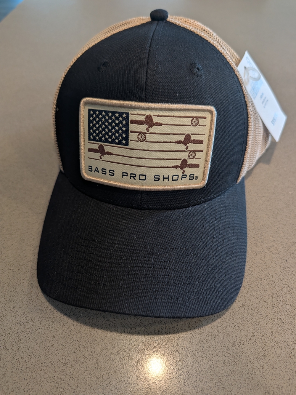 Bass Pro Shops Black Front Tan Mesh Trucker Hat with Flag Patch